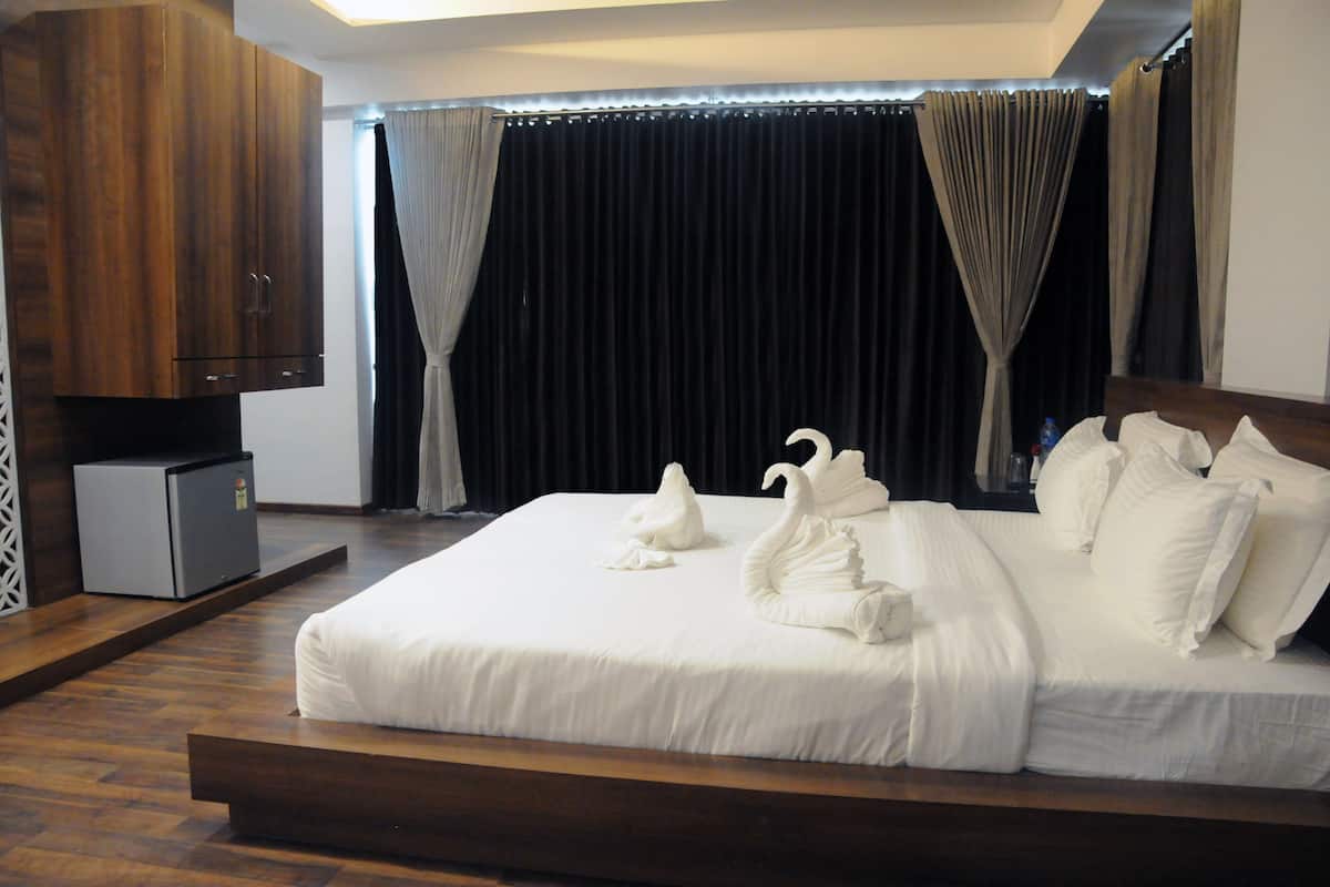 Habitación superior | Ropa de cama de alta calidad y minibar