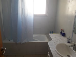 Basic Apartment, 2 Bedrooms | Bathroom | Combined shower/tub, deep soaking tub, free toiletries, hair dryer