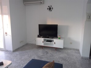 Basic Apartment, 2 Bedrooms | Living area | 40-inch flat-screen TV with satellite channels, TV - Carrefour's Appartment (La Marsa)
