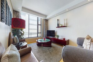 Luxury-Apartment, 1 Schlafzimmer, Nichtraucher | Wohnzimmer | Flachbildfernseher