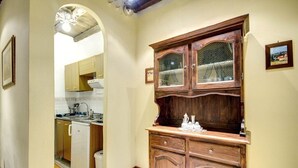A kitchen with wooden cabinets, a refrigerator, and a sink. - PF Apartment 2 Bedroom- and you're in Piazza Navona CIN:IT058091C2SLMC5MBC (Roma)