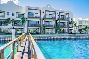 Guests can enjoy a walkway over the pool from the hotel's wooden deck.