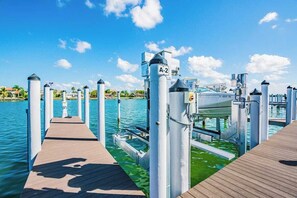 Stroll along the pier, taking in the views of the surrounding waters and dock area.