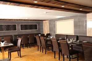 Enjoy dining in style with a spacious table and comfortable seating, perfect for presentations or entertainment.
