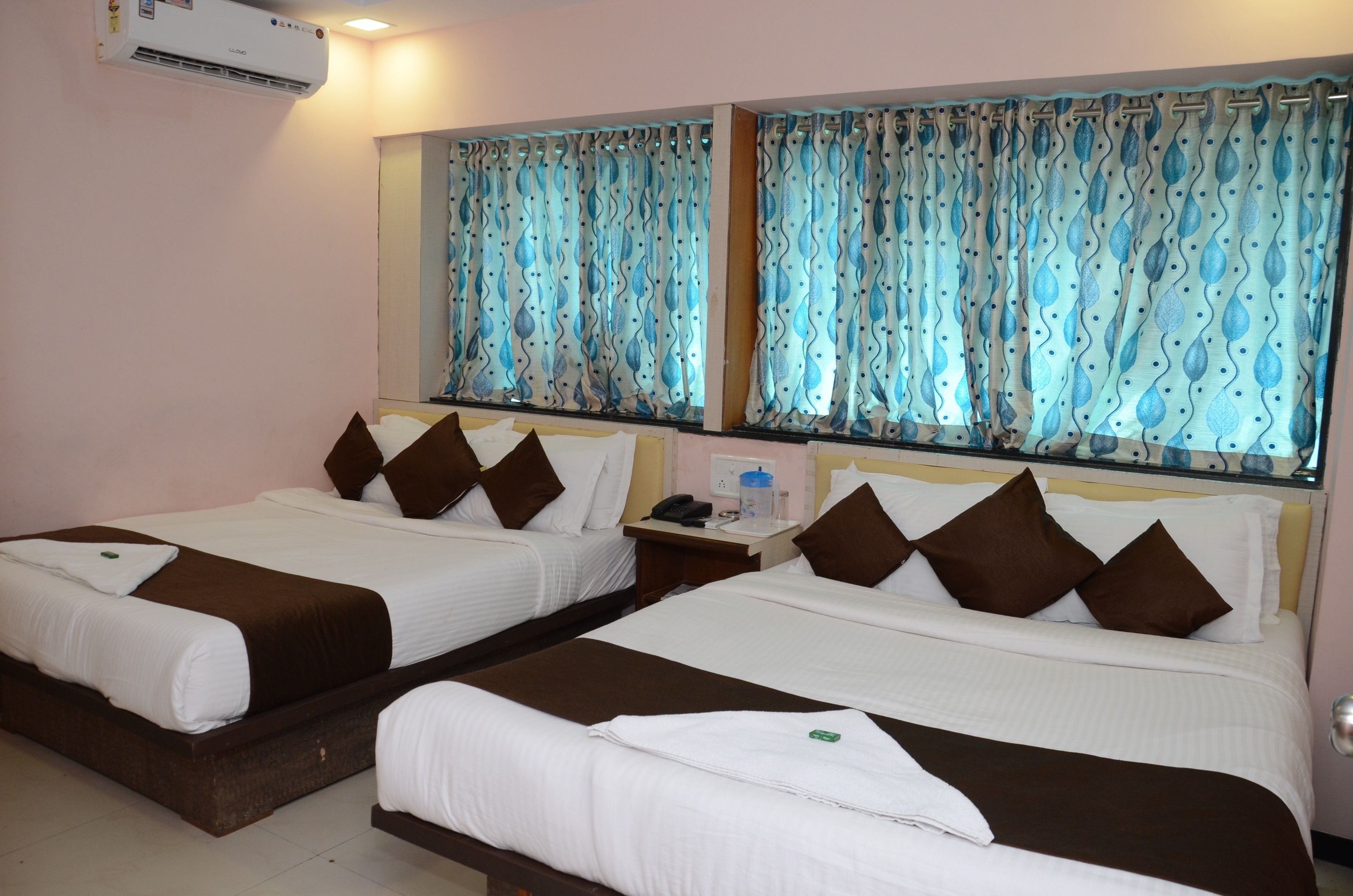 Family Suite, Multiple Beds, Smoking, City View | 1 bedroom, in-room safe, desk, iron/ironing board