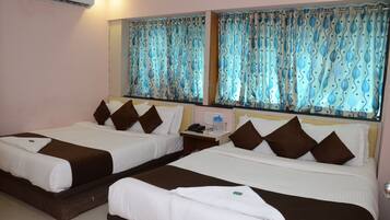 Family Suite, Multiple Beds, Smoking, City View | 1 bedroom, in-room safe, desk, iron/ironing board