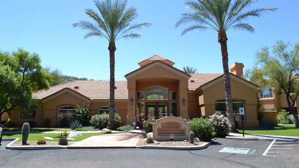 A building with a sign reading "Welcome to Pinnacle Canyon."
