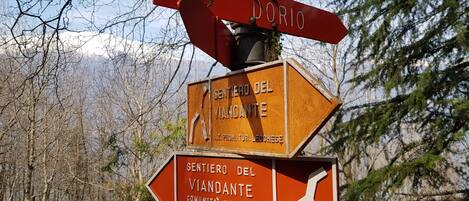 A directional signpost with multiple arrows pointing in different directions, indicating various destinations.