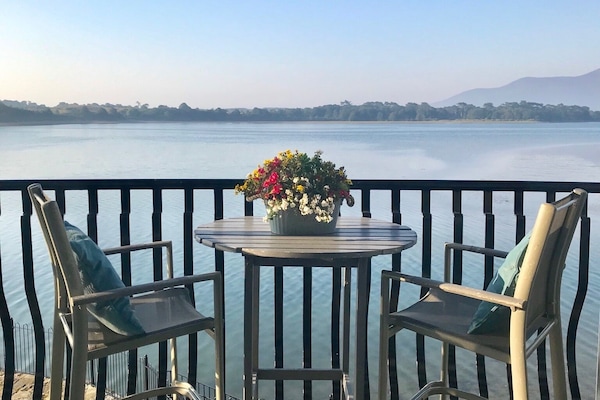 Relax on the balcony to take in the sweeping views of the bay and mountains