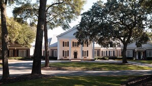 A large, stately building with a symmetrical facade, multiple windows, and a central entrance.