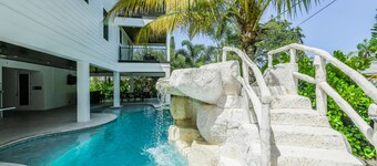 Multi family beach house! 9 bedrooms, pool with waterslide + rooftop deck