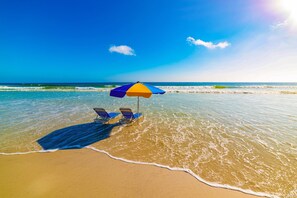 On the beach, sun-loungers, beach towels