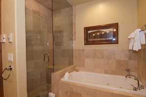 Bathtub, jetted bath, hair dryer, towels