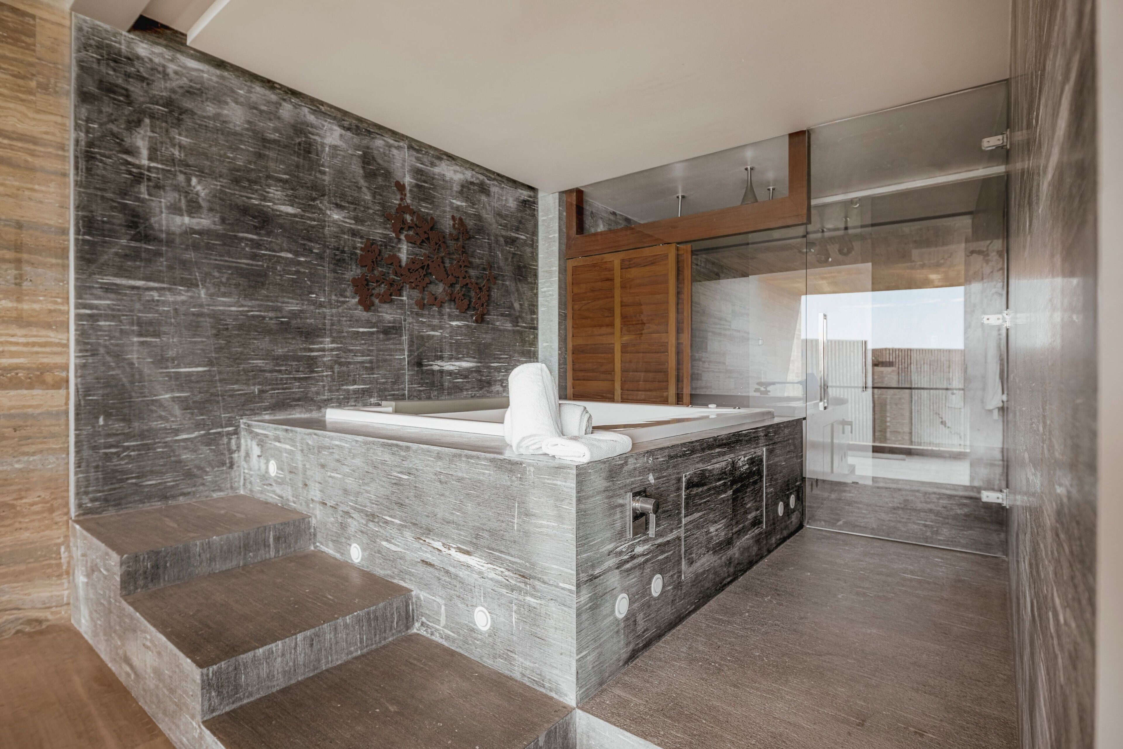 wellness suite | bathroom | free toiletries, hair dryer, slippers, towels