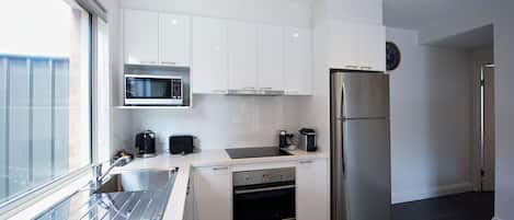 Full-sized fridge, microwave, espresso maker, coffee/tea maker