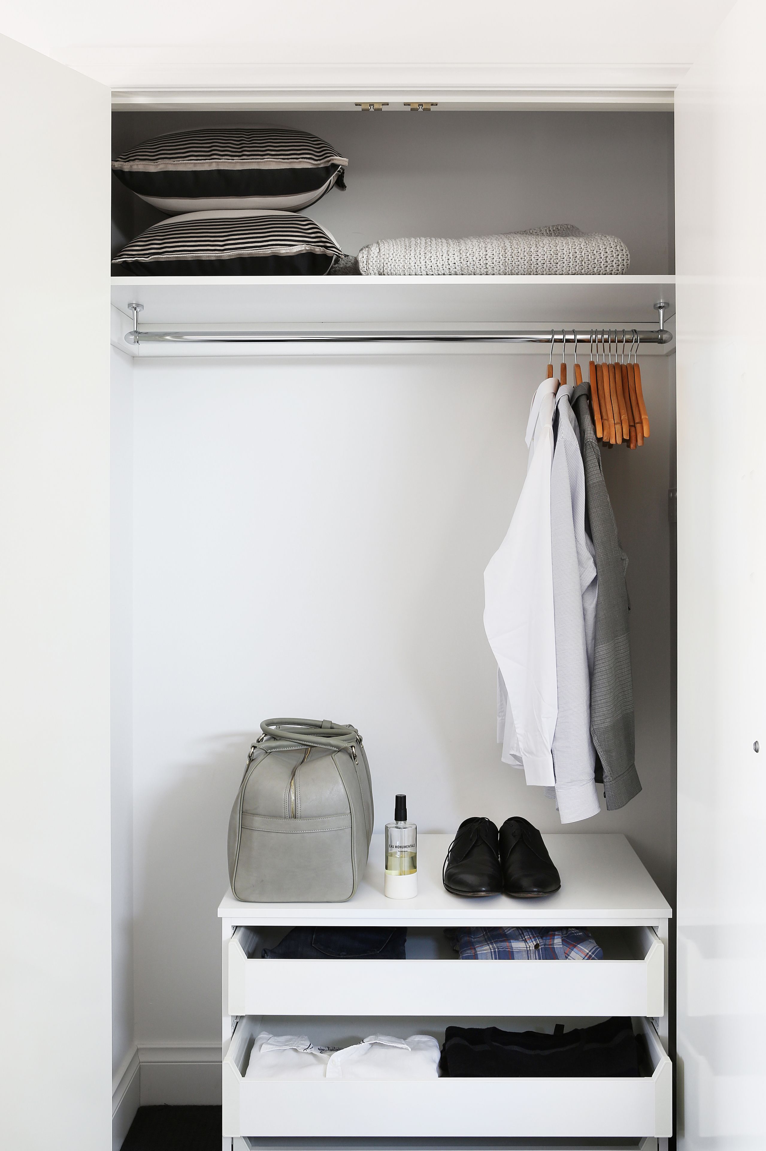 A closet with shelves, hanging space, and drawers.