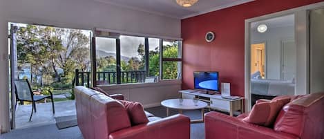 2 Bedroom Oceanfront Apartment  | Living area | Flat-screen TV