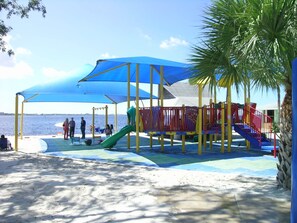 Playful beachside fun awaits at this seaside playground with a slide and climbing elements.