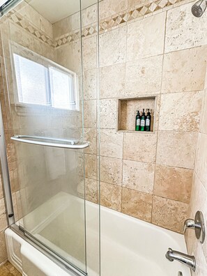 Combined shower/bathtub, hair dryer, towels, soap