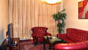 Deluxe Suite | Living area | LCD TV