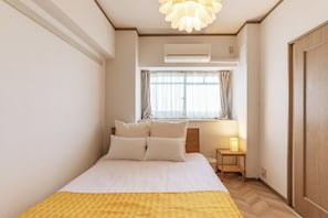 Family Apartment, 3 Bedrooms | Desk, laptop workspace, blackout drapes, iron/ironing board - Universal Bay Condominium (Osaka)