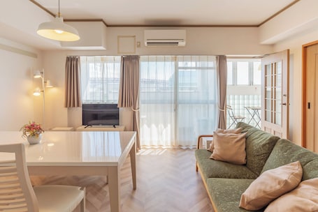 Family Apartment, 3 Bedrooms | Living area | 32-inch flat-screen TV with digital channels, TV