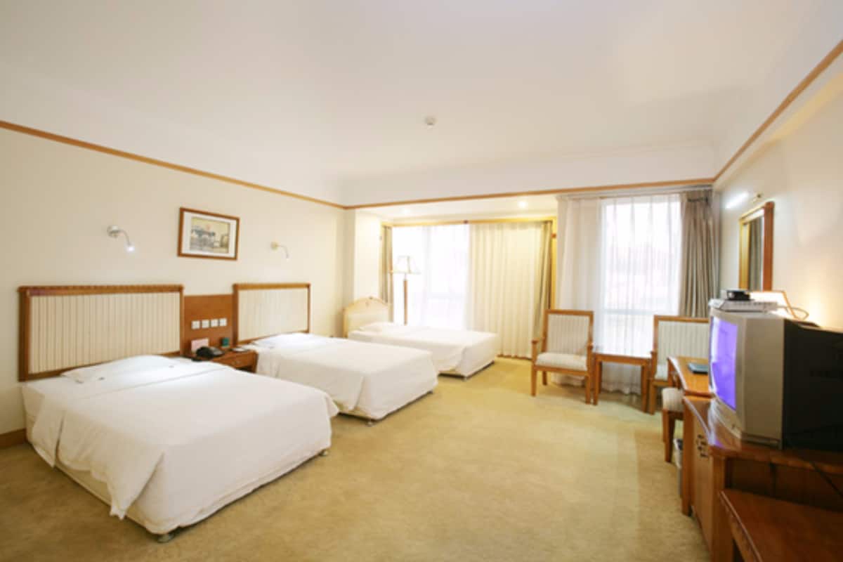 Standard Triple Room | Minibar, in-room safe, desk, blackout drapes