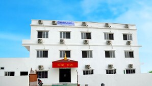 A multi-story building with a sign reading "Hotel Joshi" and multiple air conditioning units. - Hotel Joshi (Siddharthanagar)