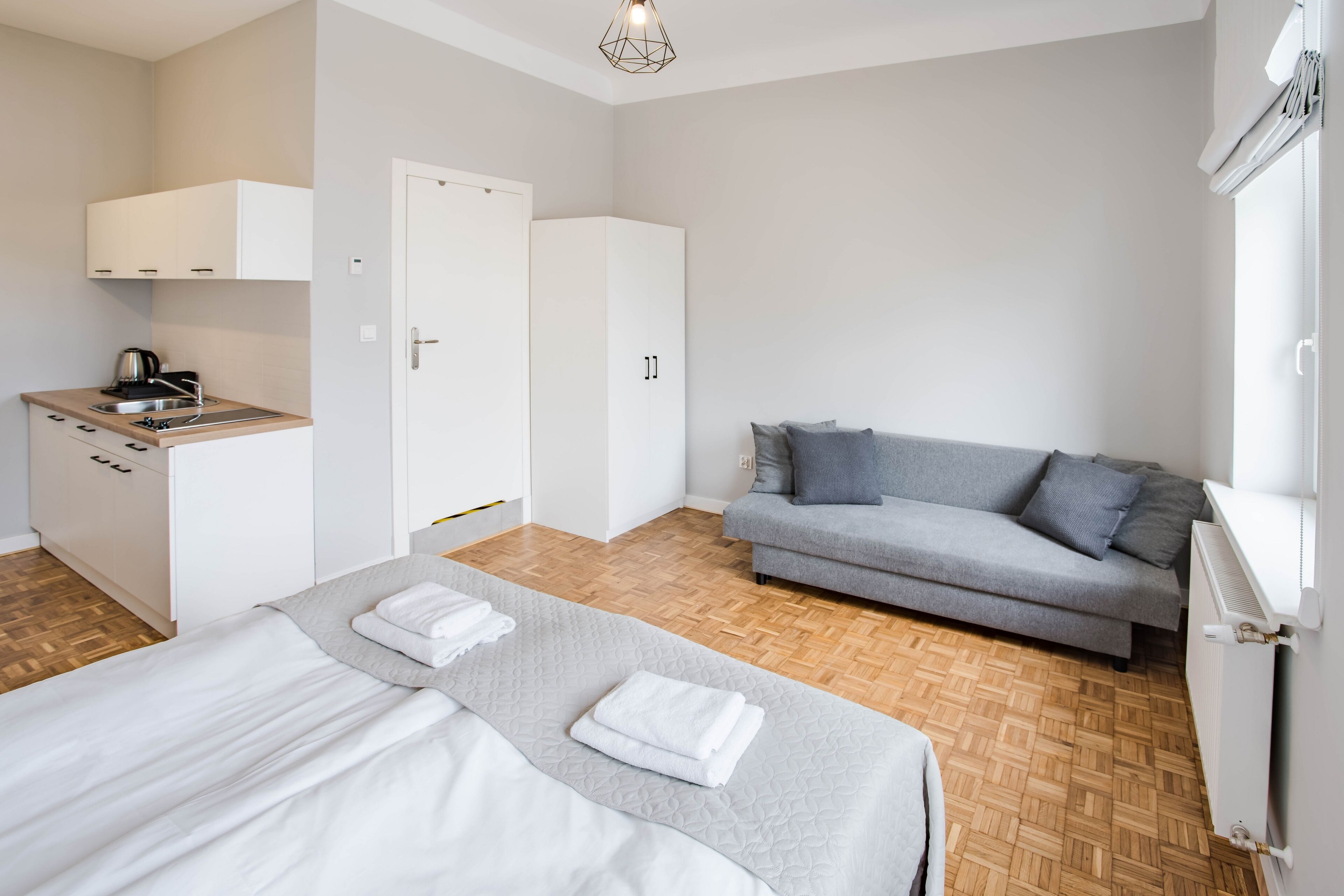 classic quadruple room | living area | flat-screen tv