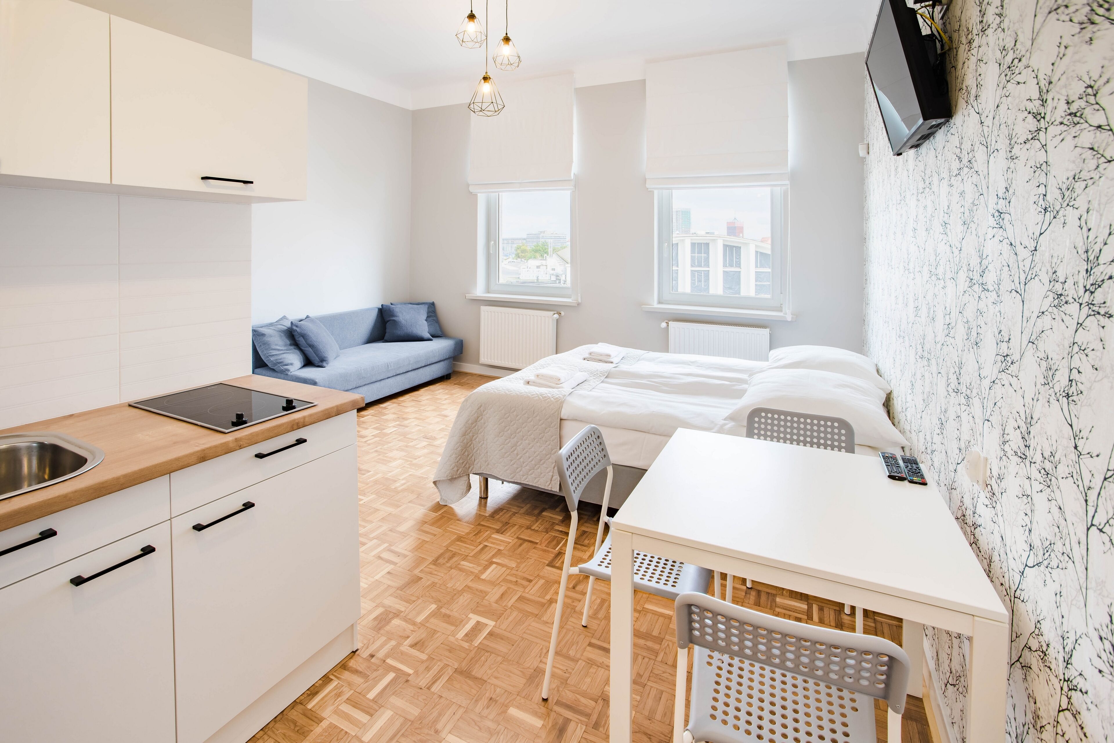 classic quadruple room | living area | flat-screen tv