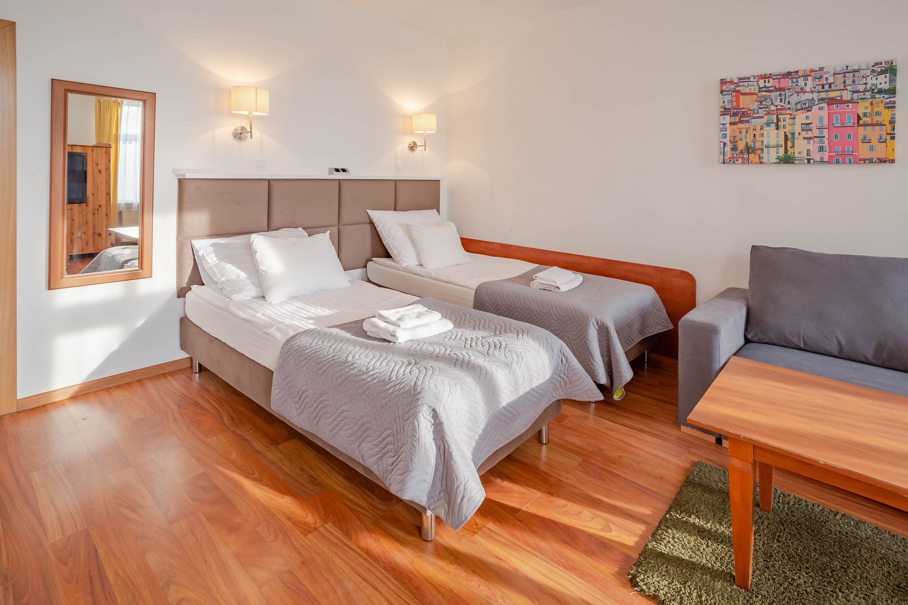 classic quadruple room | living area | flat-screen tv