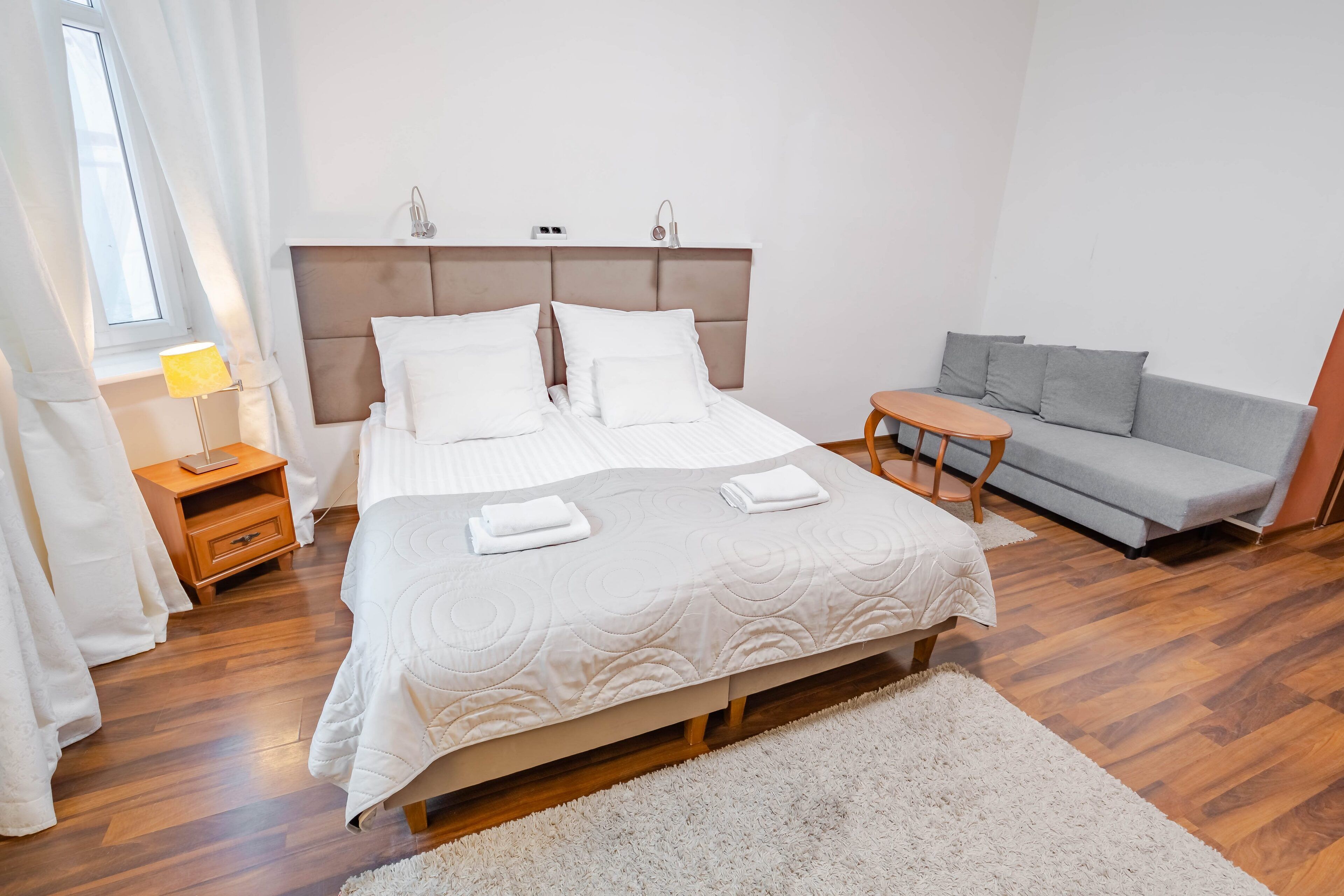 classic quadruple room | living area | flat-screen tv