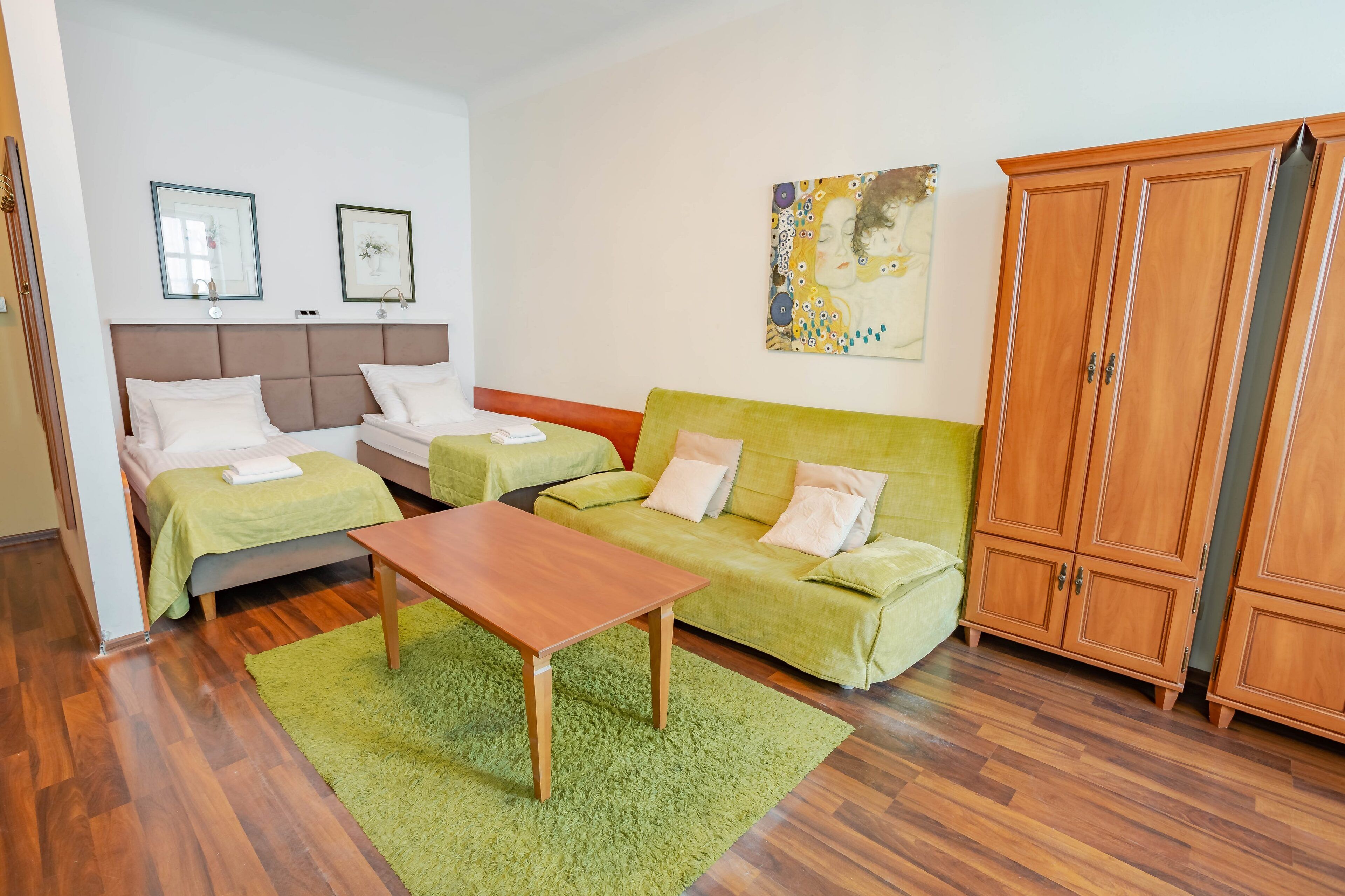 classic quadruple room | living area | flat-screen tv