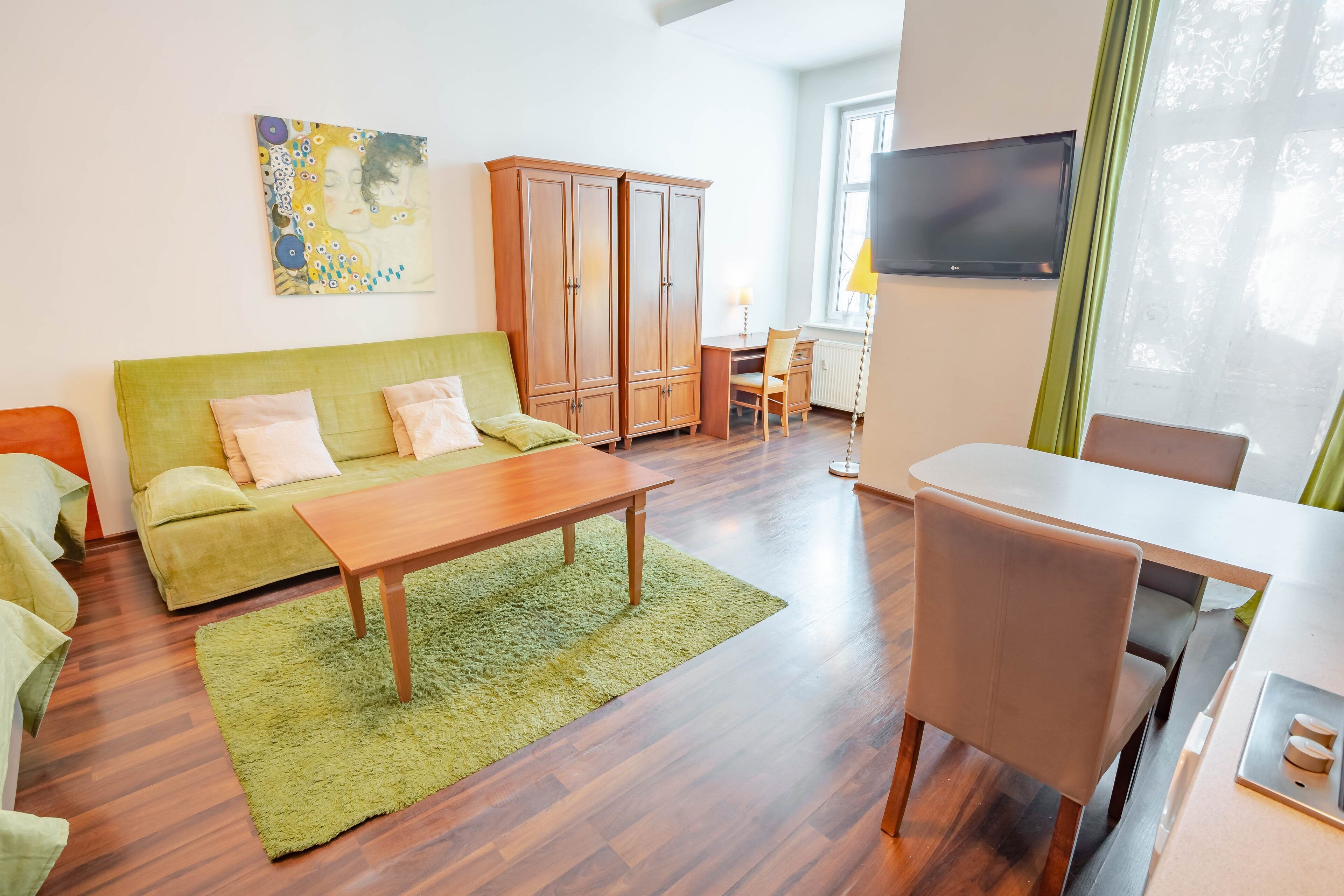 classic quadruple room | living area | flat-screen tv