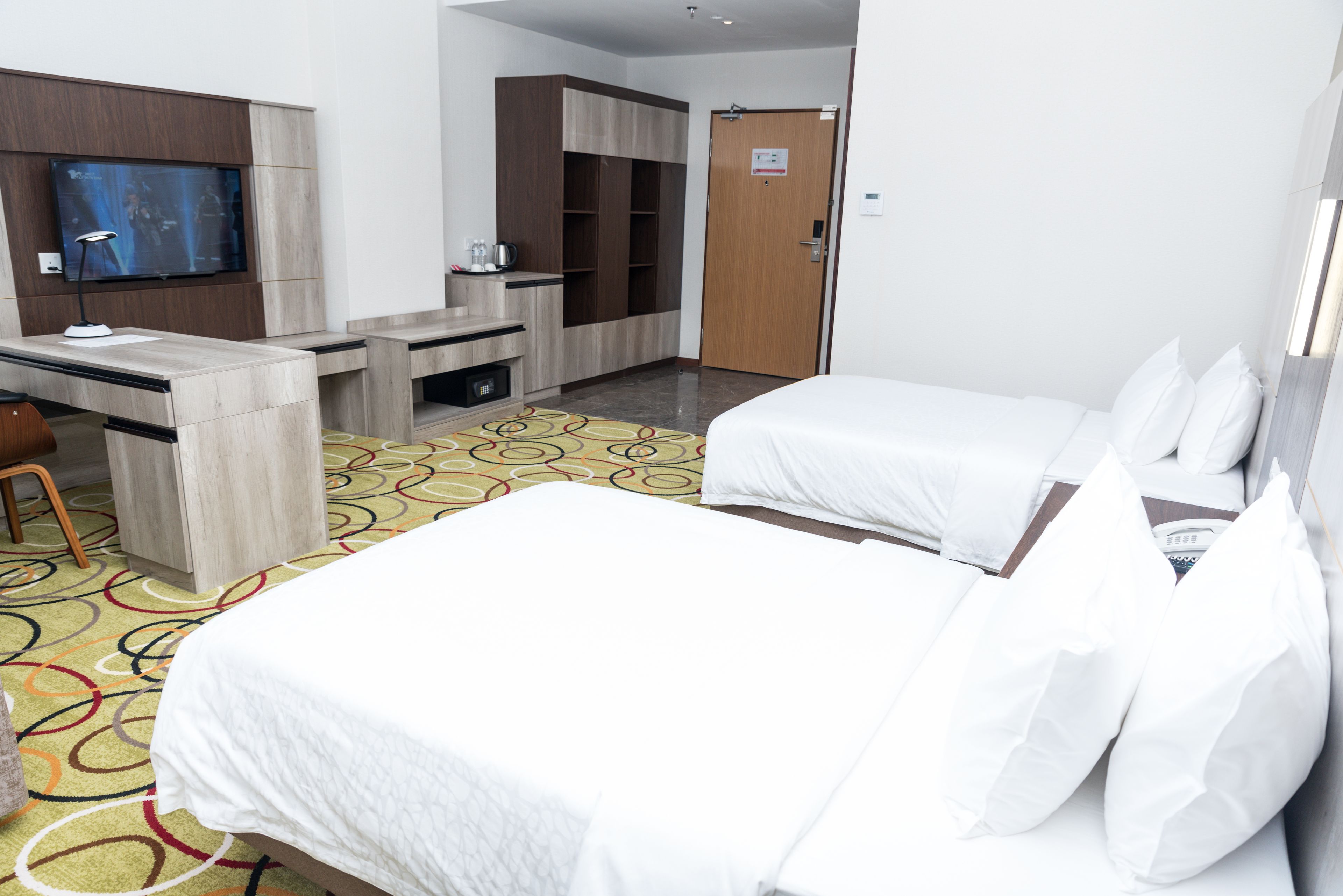 deluxe premium room | in-room safe, desk, soundproofing, iron/ironing board