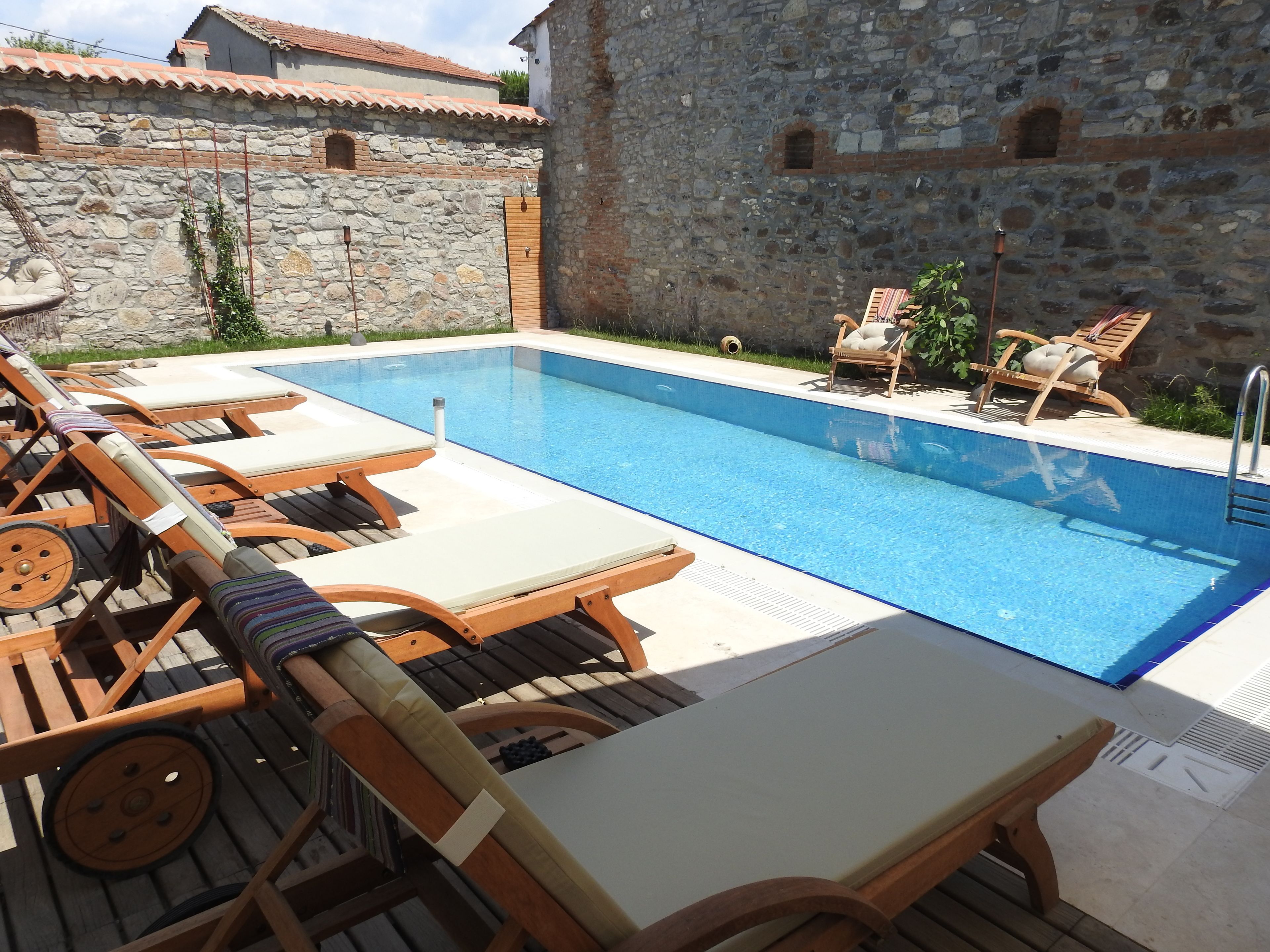 outdoor pool, pool umbrellas, pool loungers