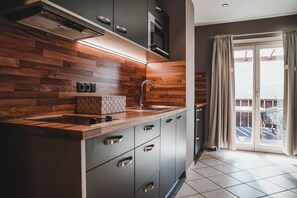 Basic Condo, 1 Bedroom, Balcony | Private kitchen | Fridge, microwave, stovetop, dishwasher - Residence Montani (Laces)