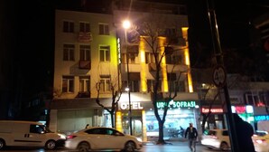 A hotel with a sign reading "UNIVERSITY SOFRASI" and a visible entrance. - Can Hotel (Bursa)