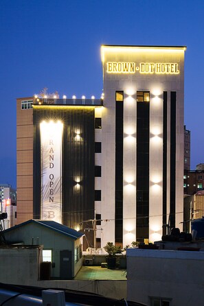 The Brown-Dot Hotel with a prominent sign, a large vertical sign for 'Grand Open', and a well-lit facade. - Brown Dot Busan Station Sky Garden (Busan)
