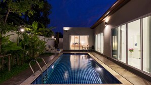 A swimming pool with a view of a bedroom and a dining area. - Private Villa with Pool near Laguna (Choeng Thale)