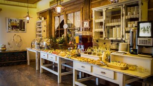 A buffet setup with various food items and a coffee station. - Kraina Smaku (Zakopane)