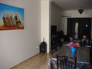 Deluxe Apartment, 2 Bedrooms, Terrace, Pool View | Living room | Flat-screen TV - Appartement AP2 Marina Saidia (Madagh)