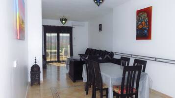 Deluxe Apartment, 2 Bedrooms, Terrace, Mountain View | Living room | Flat-screen TV