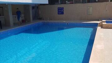 Outdoor pool, open 8:00 AM to 7:00 PM, pool umbrellas, sun loungers