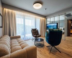 Deluxe-Apartment | Wohnbereich | Flachbildfernseher