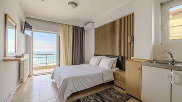 Superior Double Room, Sea View | In-room safe, desk, laptop workspace, iron/ironing board