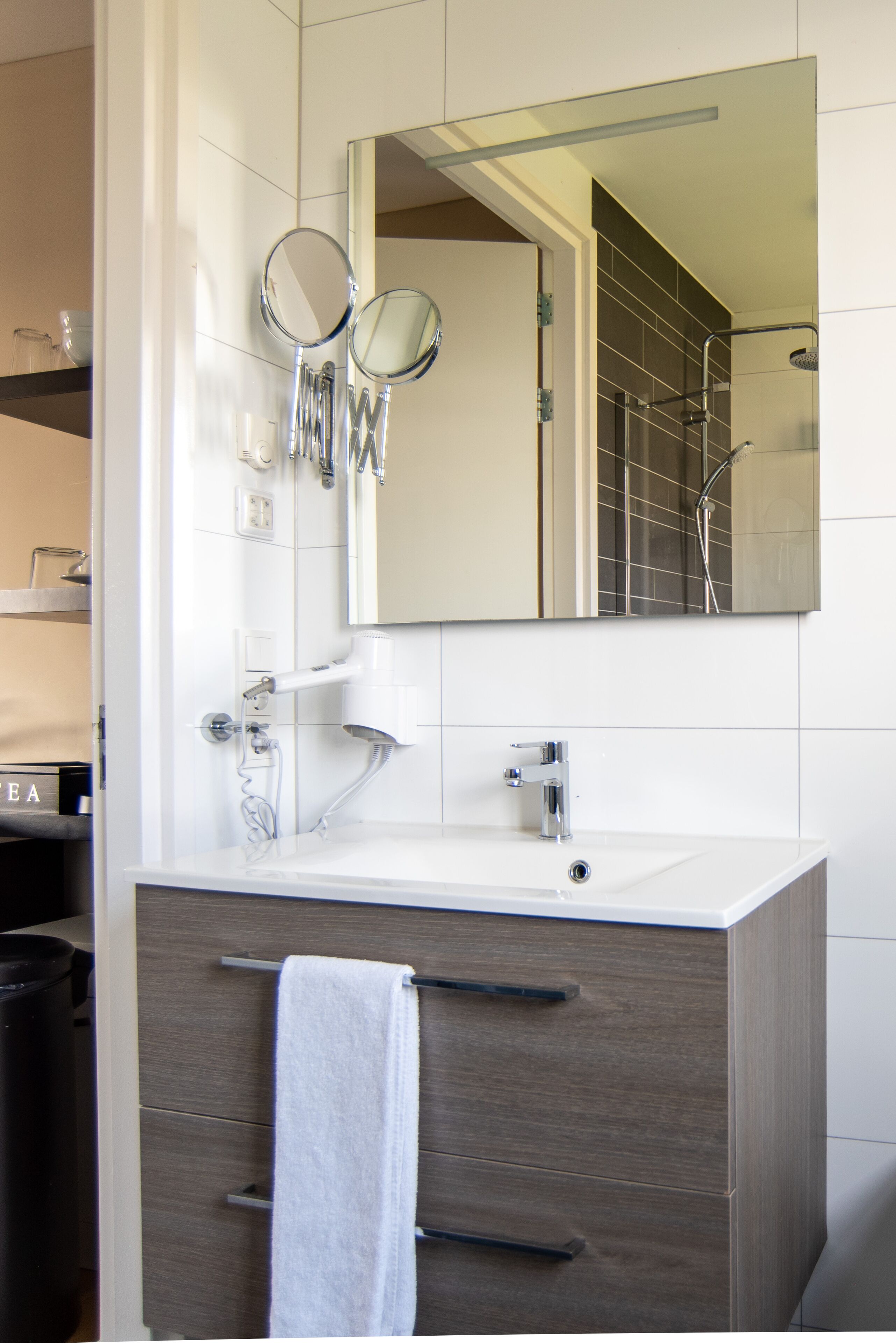 studio, 1 king bed with sofa bed, kitchenette, lake view | bathroom | shower, rainfall showerhead, hair dryer, towels