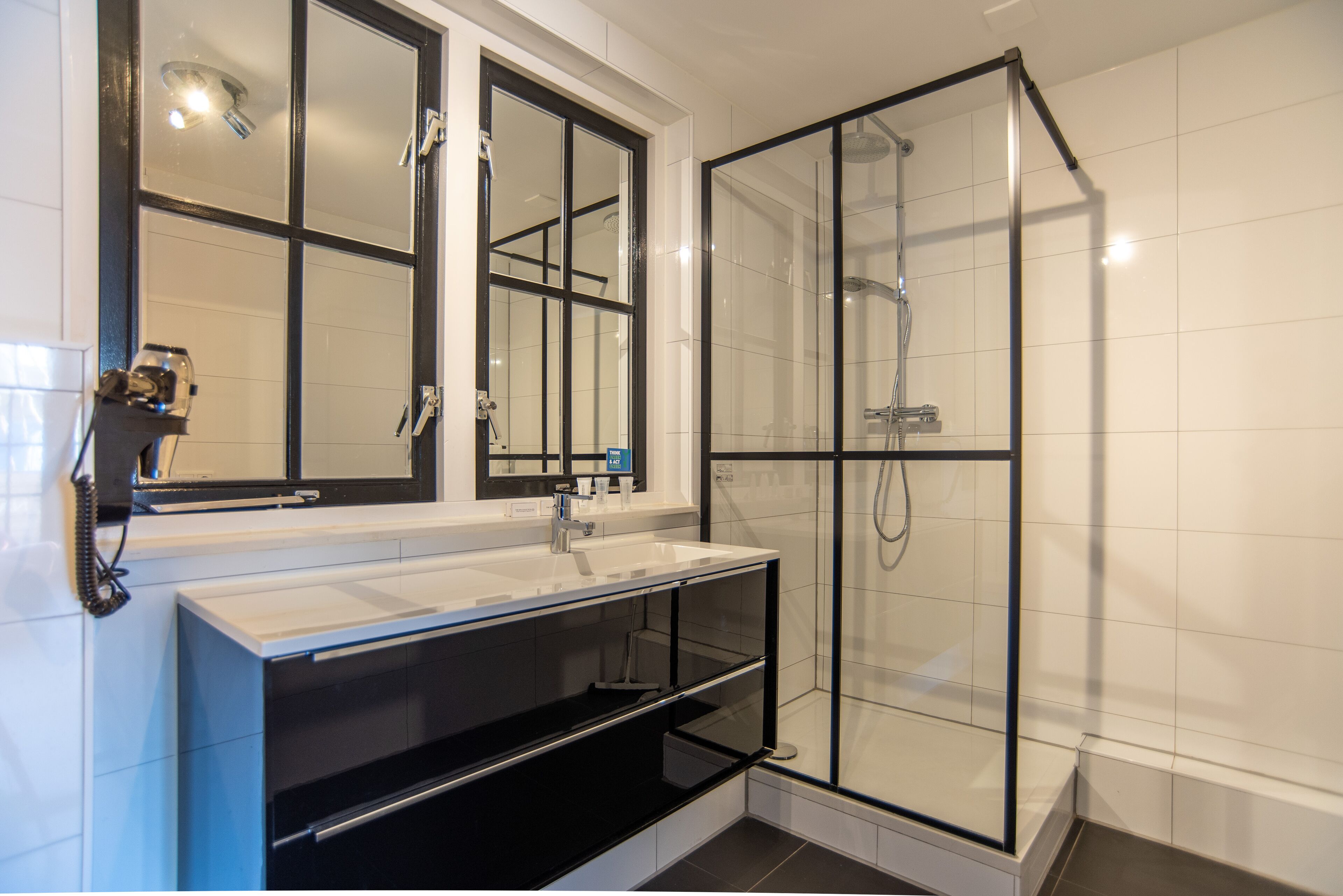 deluxe studio | bathroom | shower, rainfall showerhead, hair dryer, towels