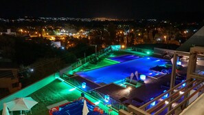 Indoor pool, outdoor pool, open 10 AM to 2:00 PM, pool umbrellas