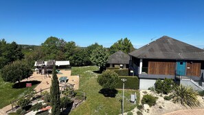 A residential area with multiple houses, a playground, and a clear sky. - Residence Croma (La Roche-Posay)